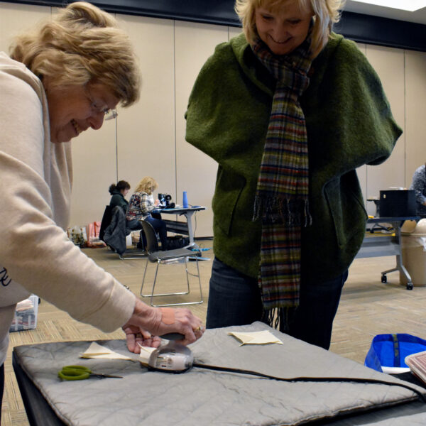 Member Irons Blocks during Quilting Workshop with Green Light Quilts